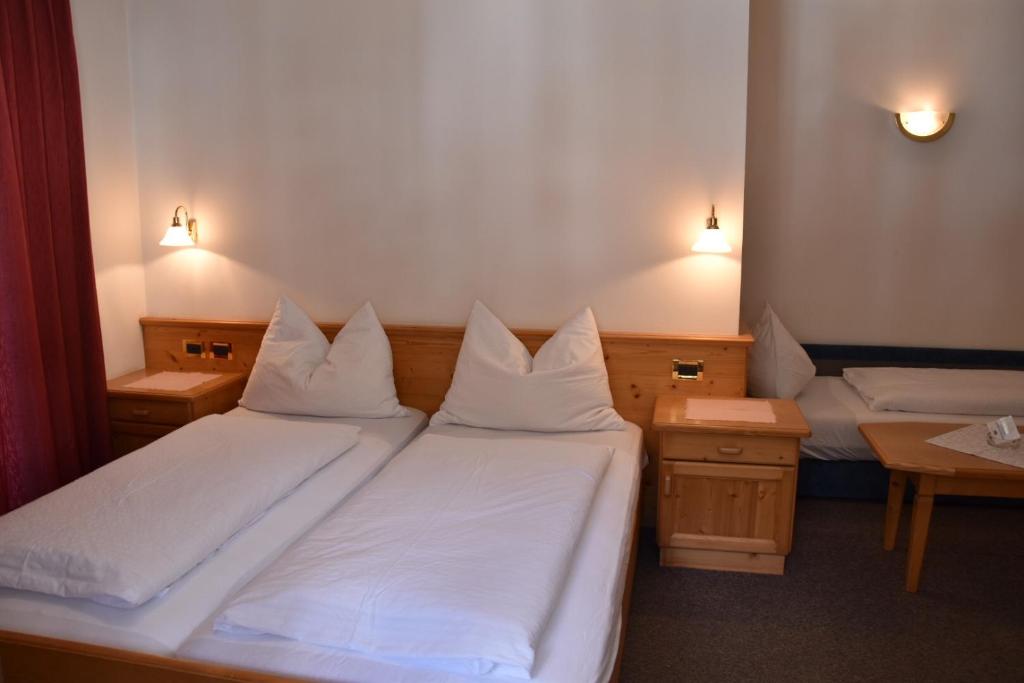 Postel nebo postele na pokoji v ubytování Garni Haus Tyrol
