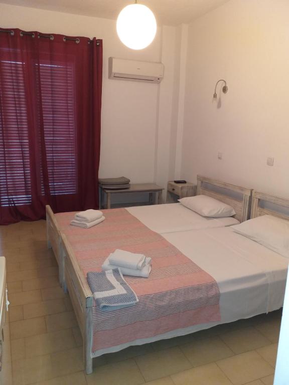 Postel nebo postele na pokoji v ubytování Ψιλή Άμμος