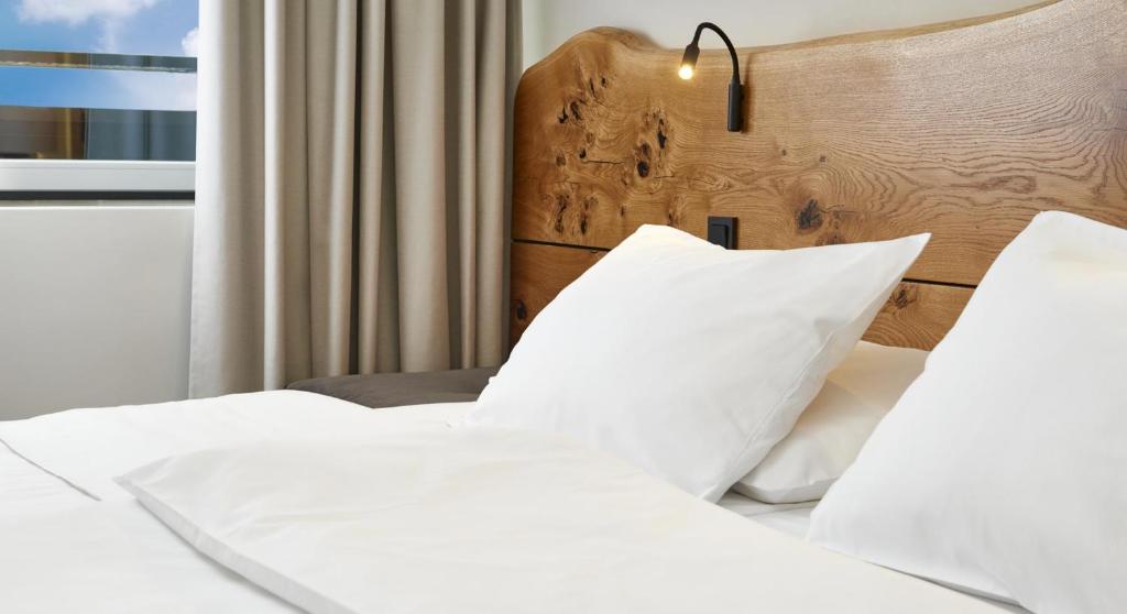 Postel nebo postele na pokoji v ubytování OREA Resort Horal Špindlerův Mlýn
