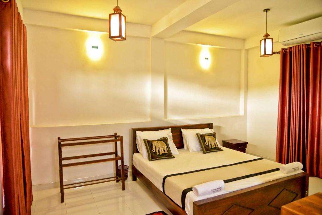 Postel nebo postele na pokoji v ubytování Ranweli Resort Anuradhapura