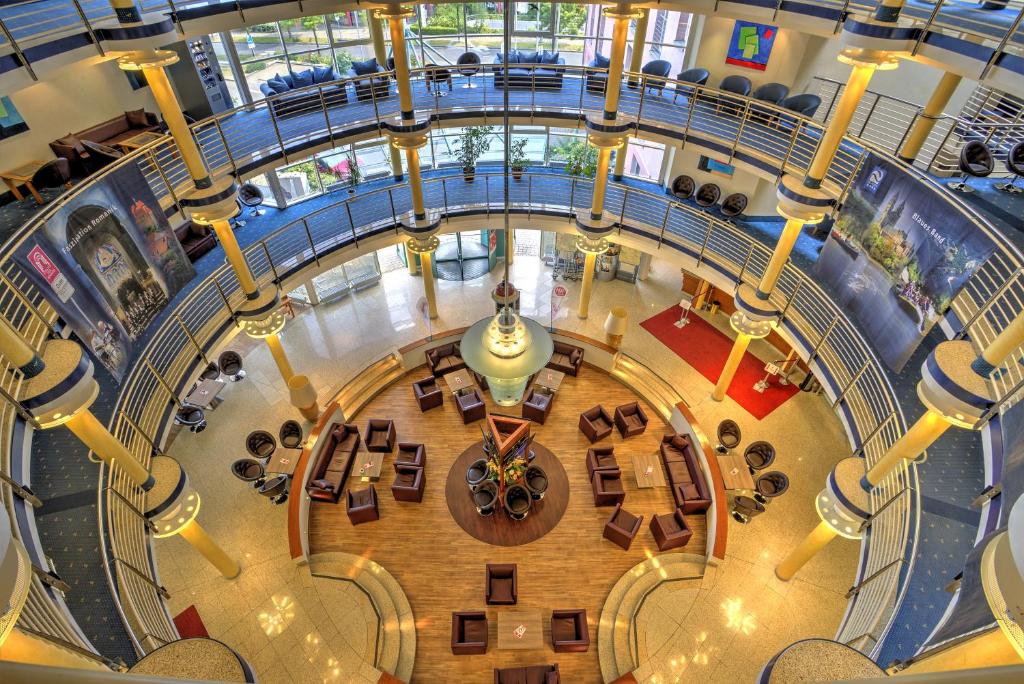 an overhead view of a large building with a lobby at Michel Hotel Magdeburg in Magdeburg