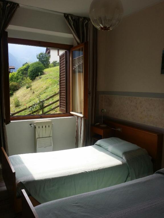 Postel nebo postele na pokoji v ubytování Albergo la Valle