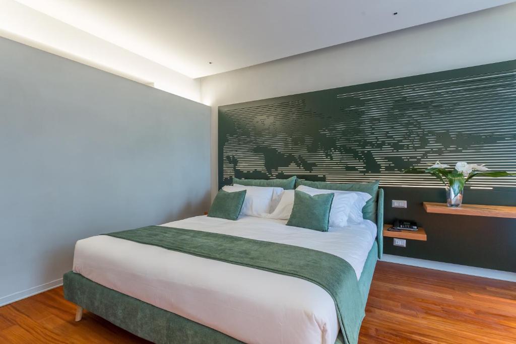 Postel nebo postele na pokoji v ubytování Fauno Urban Resort