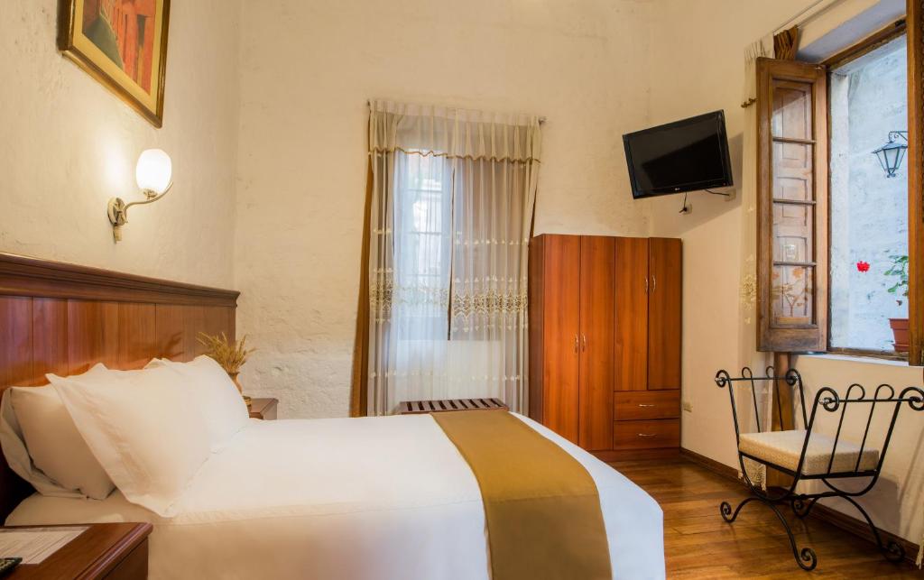 Postel nebo postele na pokoji v ubytování Majestad Hotel Boutique