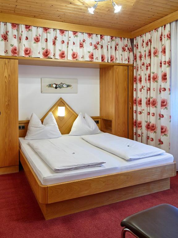 Postel nebo postele na pokoji v ubytování Pension Haus Aschgan