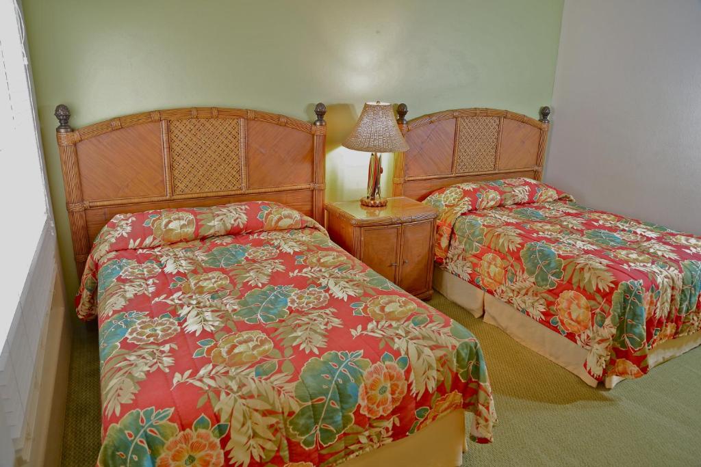 Postel nebo postele na pokoji v ubytování Club Wyndham Bali Hai Villas