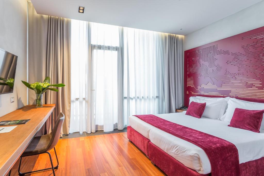 Postel nebo postele na pokoji v ubytování Fauno Urban Resort