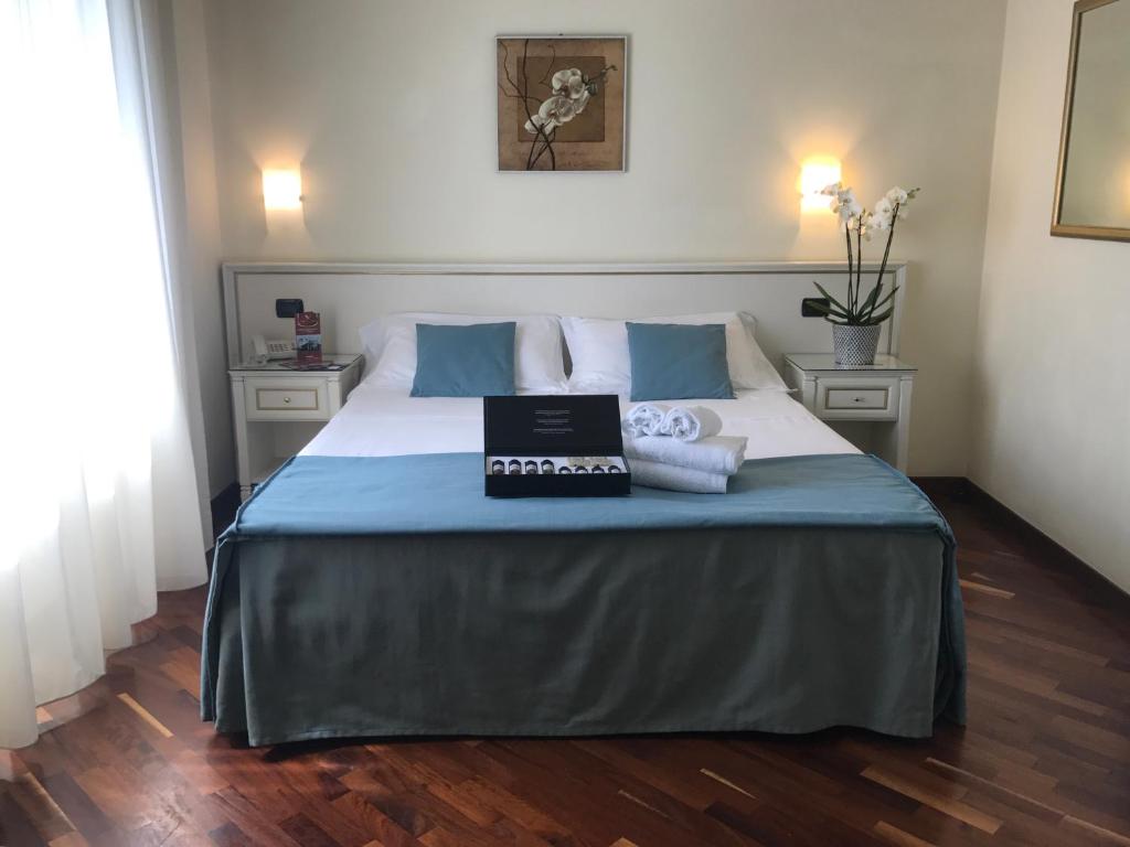 Postel nebo postele na pokoji v ubytování Costa Hotel