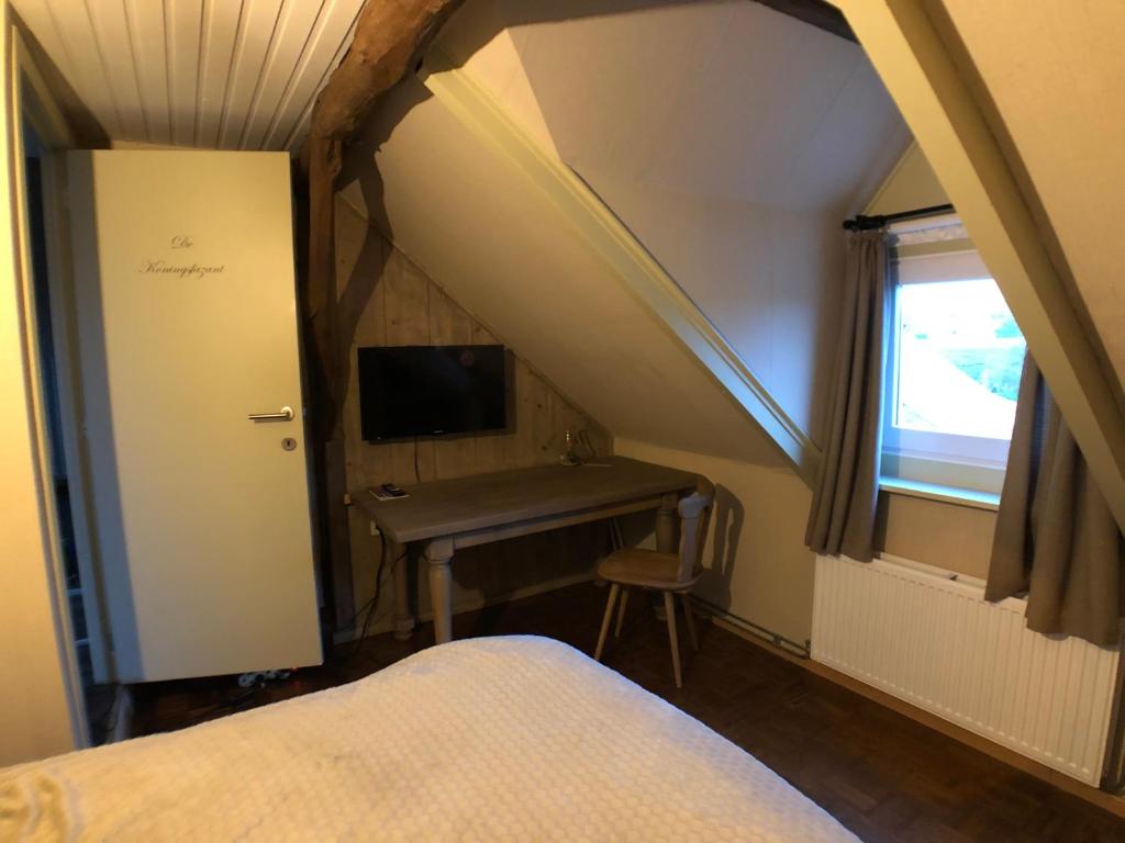 Postel nebo postele na pokoji v ubytování De Holsterhoeve