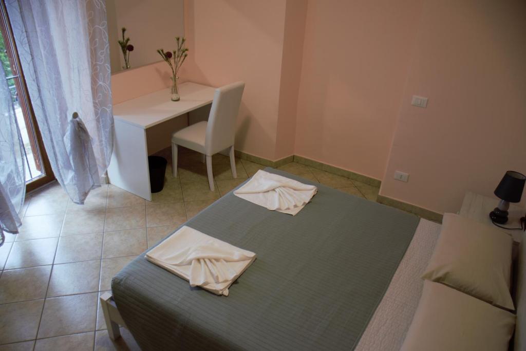 Posteľ alebo postele v izbe v ubytovaní B&B La Vecchia Osteria