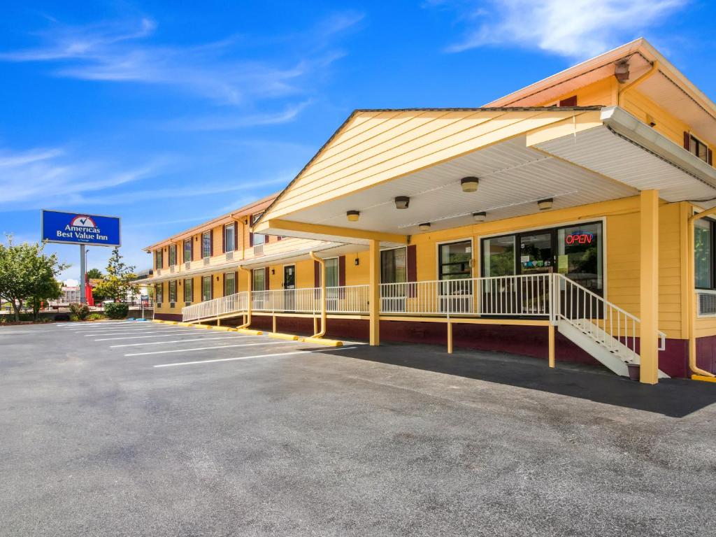 a view of a hotel with a parking lot at Americas Best Value Inn - Clayton in Clayton