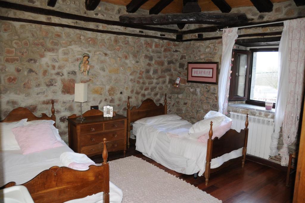 A bed or beds in a room at La Casona de los Nonos