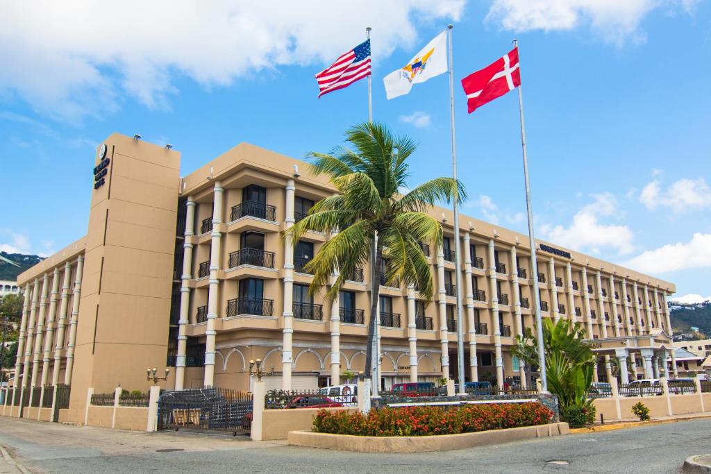 a large building with a flag on top of it at Windward Passage Hotel in Charlotte Amalie