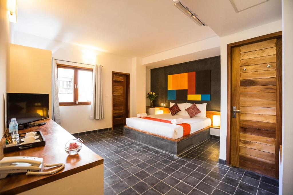 Postel nebo postele na pokoji v ubytování PATIO Hotel & Urban Resort