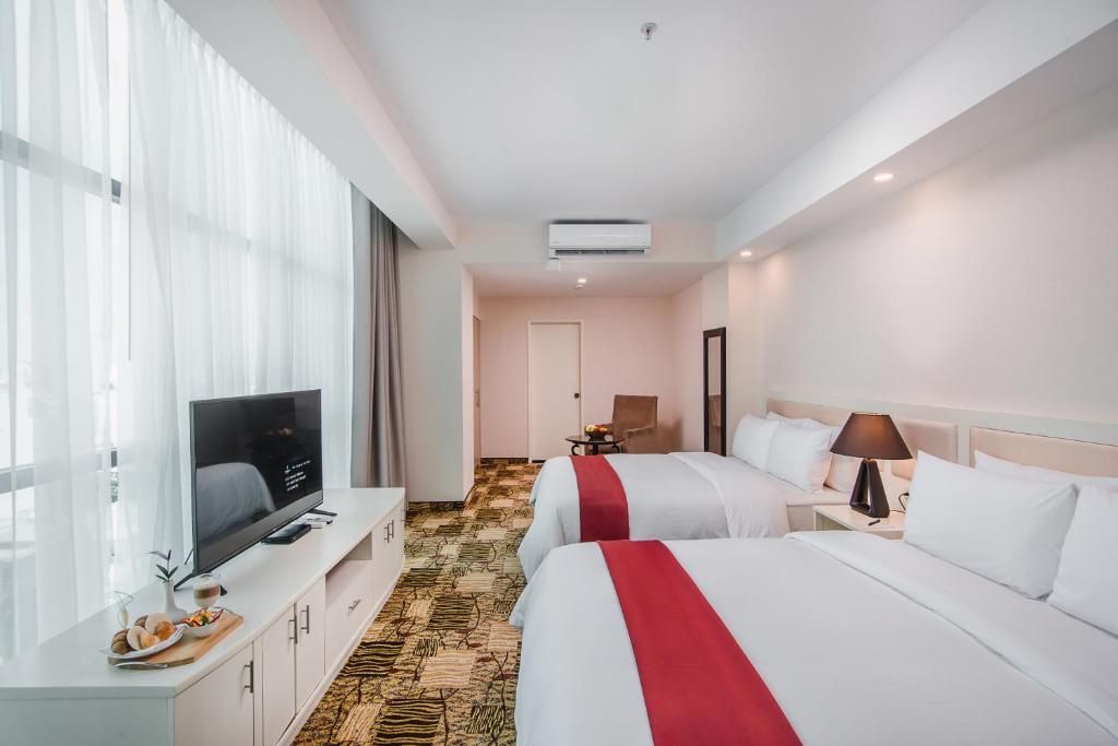 Postel nebo postele na pokoji v ubytování Nobility Grand Hotel