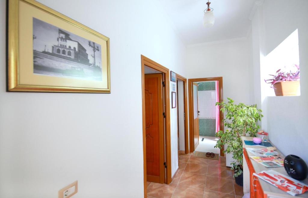 a hallway of a house with a picture on the wall at My Home Guest House-Apartment in Durrës