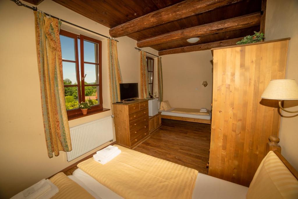 Postel nebo postele na pokoji v ubytování Stary dum