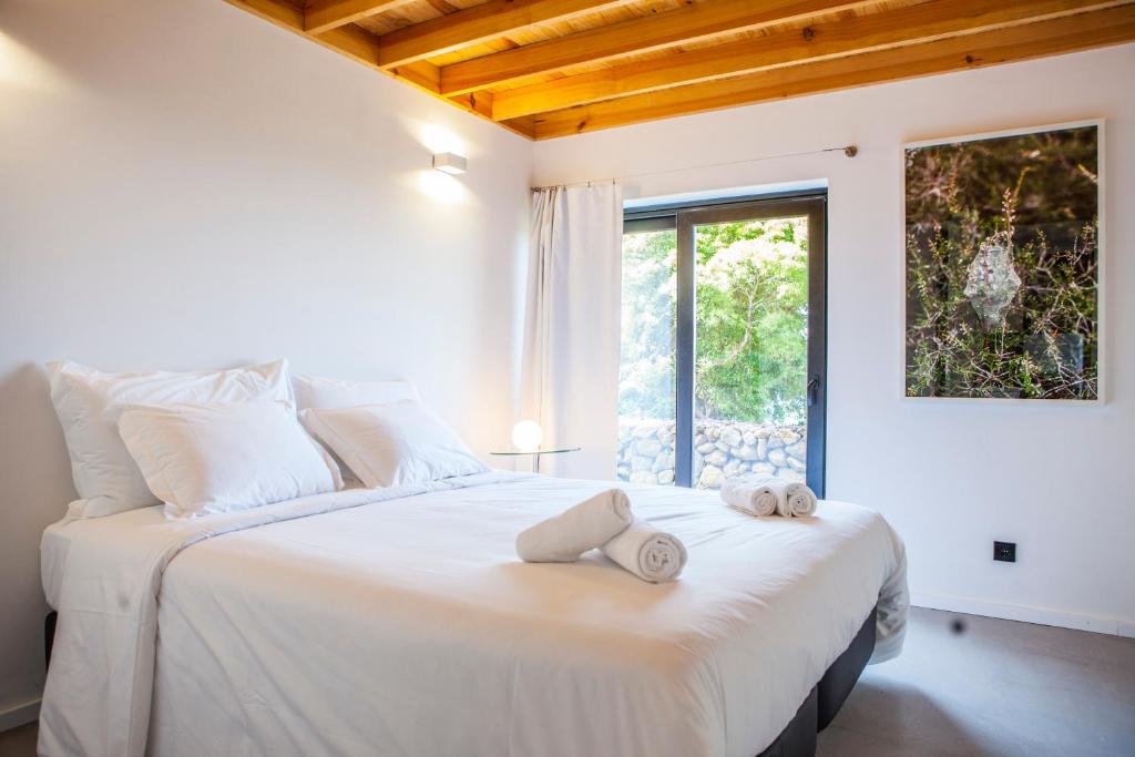 Postel nebo postele na pokoji v ubytování Caparica Azores Ecolodge