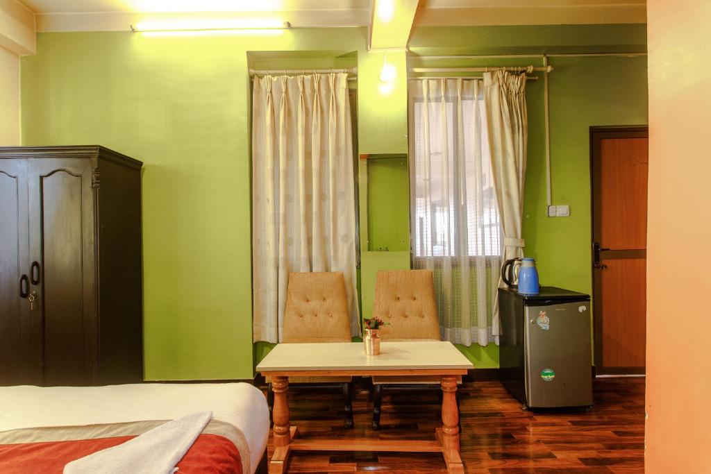 Postel nebo postele na pokoji v ubytování Hotel Nepalaya