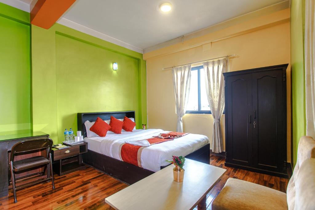 Postel nebo postele na pokoji v ubytování Hotel Nepalaya
