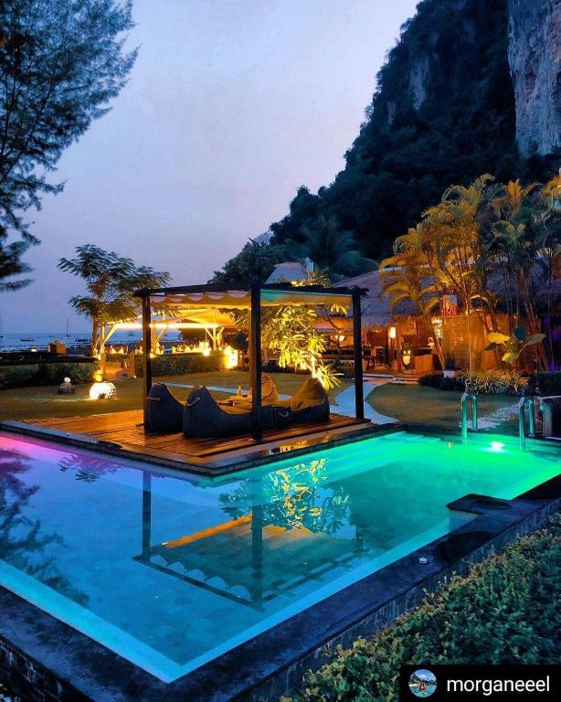 a resort with a pool and a villa at Mama Beach Residence - Adults Only in Phi Phi Islands