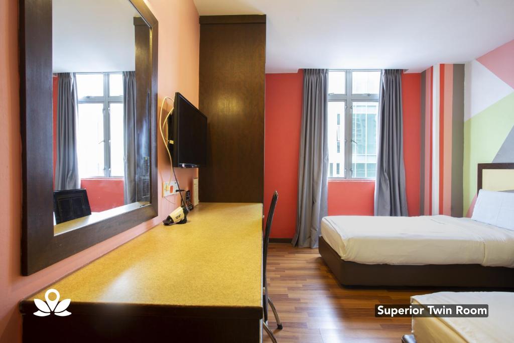 Postel nebo postele na pokoji v ubytování Hotel Weilia
