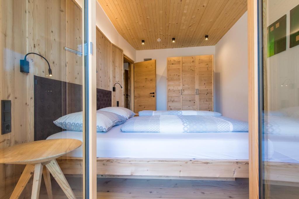 Postel nebo postele na pokoji v ubytování Eco Bnb & Apartments Bründlerhof