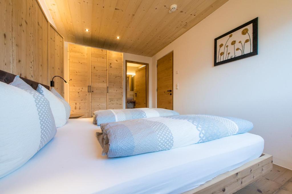 Postel nebo postele na pokoji v ubytování Eco Bnb & Apartments Bründlerhof