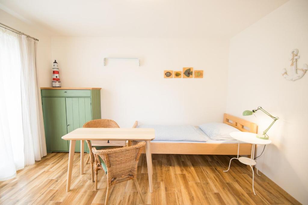 Posteľ alebo postele v izbe v ubytovaní Apartmány Lea