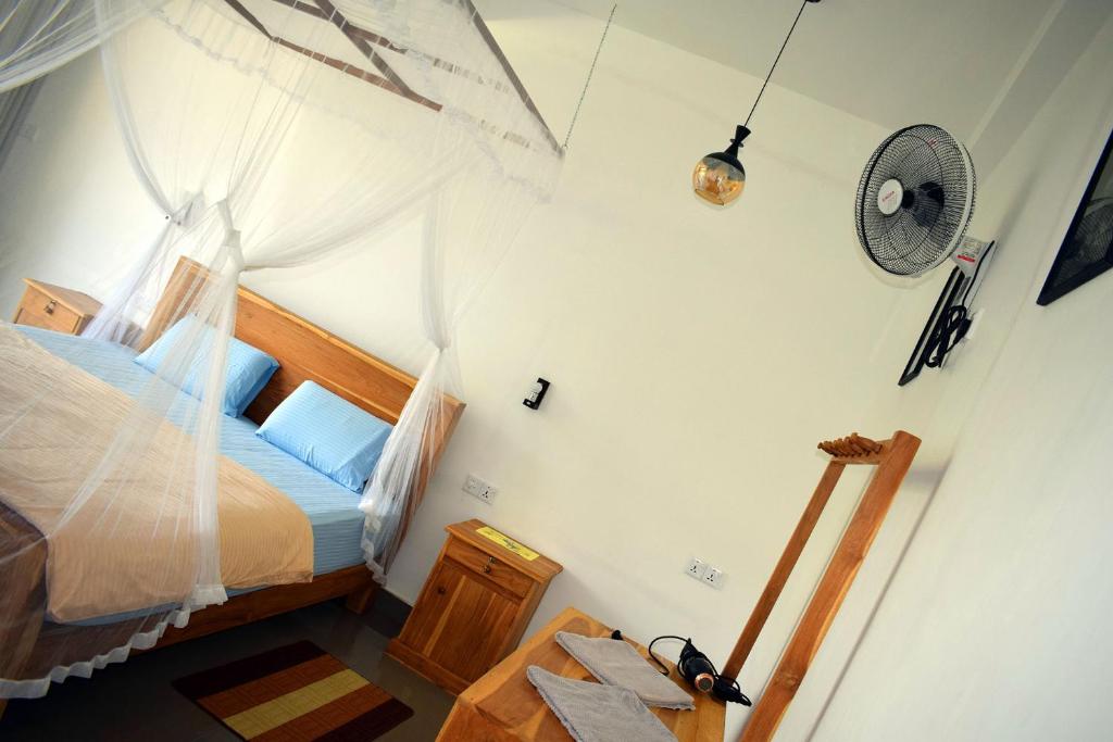 Postel nebo postele na pokoji v ubytování Raveena Guest House