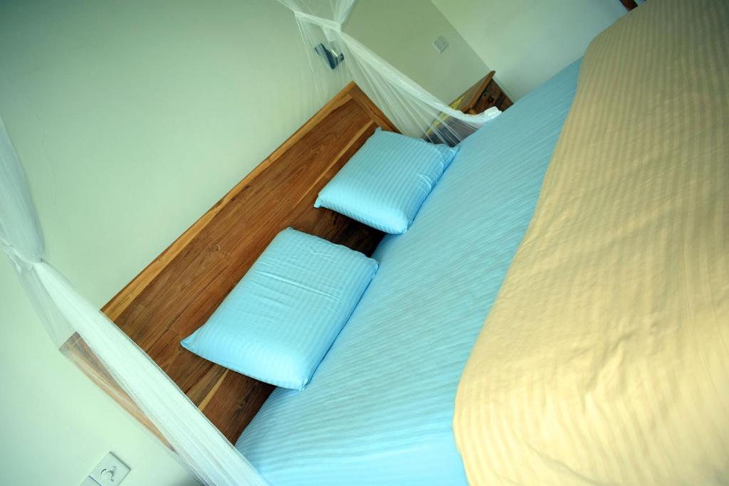 Postel nebo postele na pokoji v ubytování Raveena Guest House