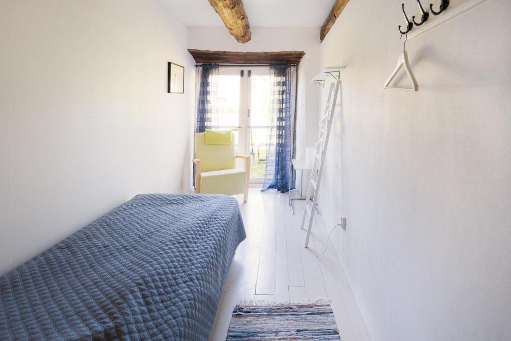 Postel nebo postele na pokoji v ubytování Liste Gård