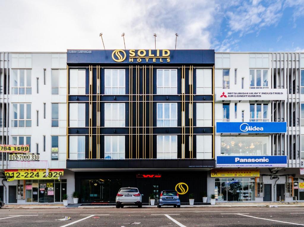 a building with a sold refuge sign on top of it at Solid Hotels in Johor Bahru