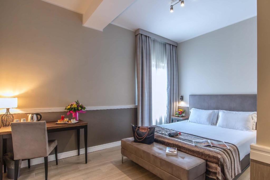 A bed or beds in a room at Fragrance Hotel St. Peter