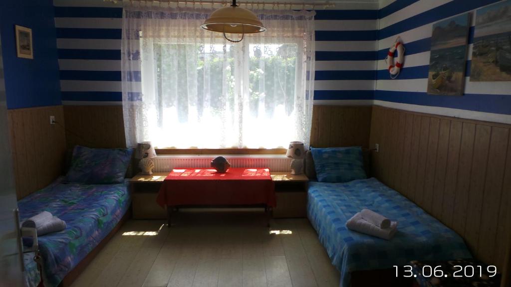 Postel nebo postele na pokoji v ubytování Iza-pokoje do wynajecia