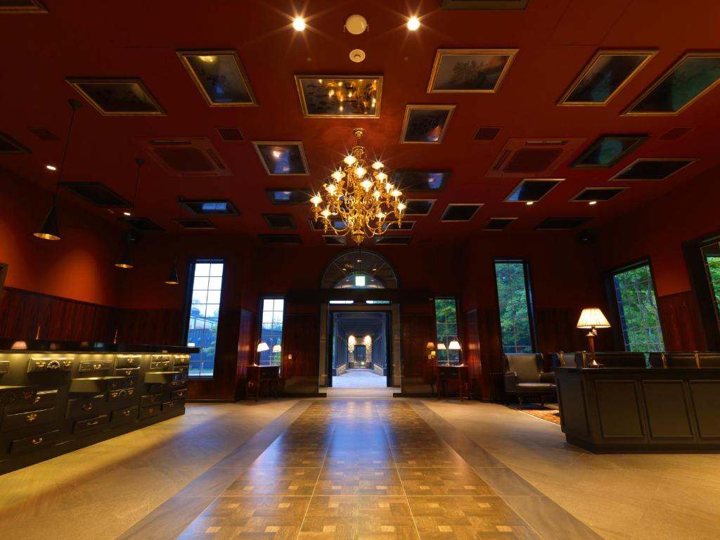 a large room with a chandelier and a wooden floor at Hakodate Onuma Tsuruga Resort EPUY in Nanae