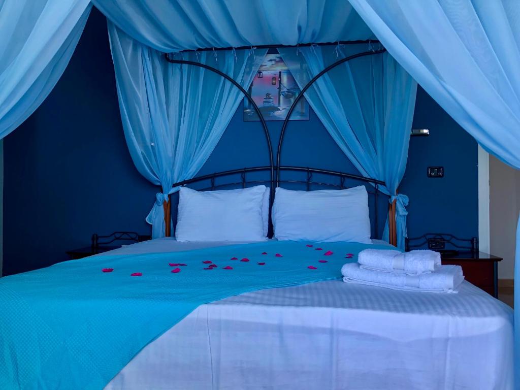 Postel nebo postele na pokoji v ubytování Envi Hotel