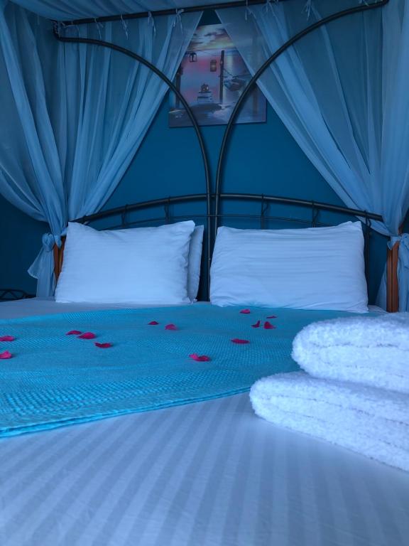 Postel nebo postele na pokoji v ubytování Envi Hotel