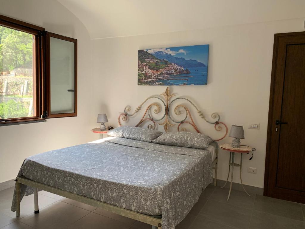 Łóżko lub łóżka w pokoju w obiekcie TENUTA BOSCO-Casa Vacanze