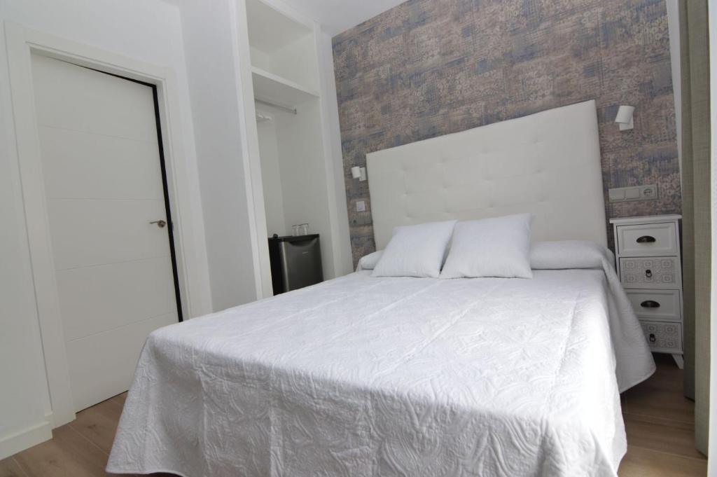 Postel nebo postele na pokoji v ubytování Hotel Castillo Benidorm