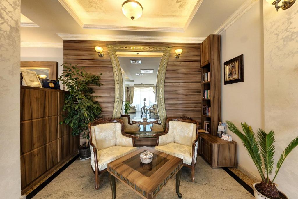 A seating area at Penelopa Palace Apart Hotel & SPA