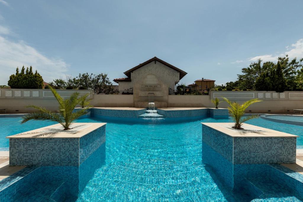 The swimming pool at or close to Penelopa Palace Apart Hotel & SPA