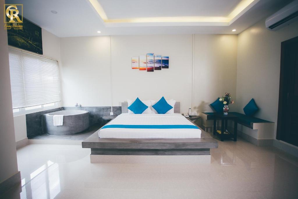 Postel nebo postele na pokoji v ubytování Chheng Residence