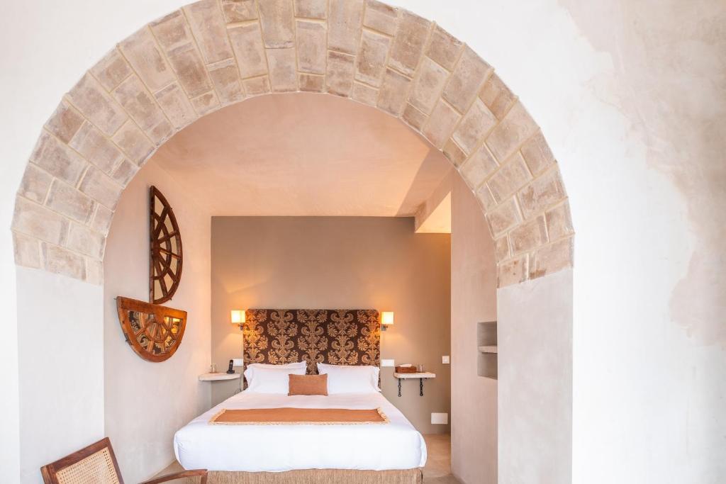 Een bed of bedden in een kamer bij Hotel Boutique V