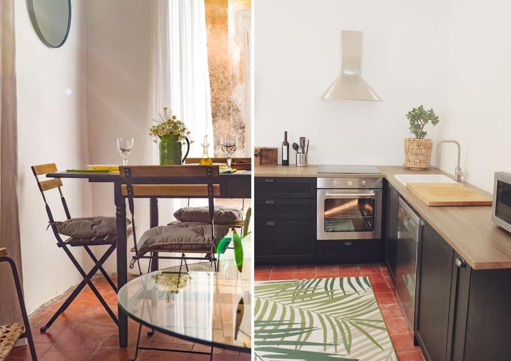 uma cozinha com uma mesa e uma sala de jantar em Le Zathery em Campagne