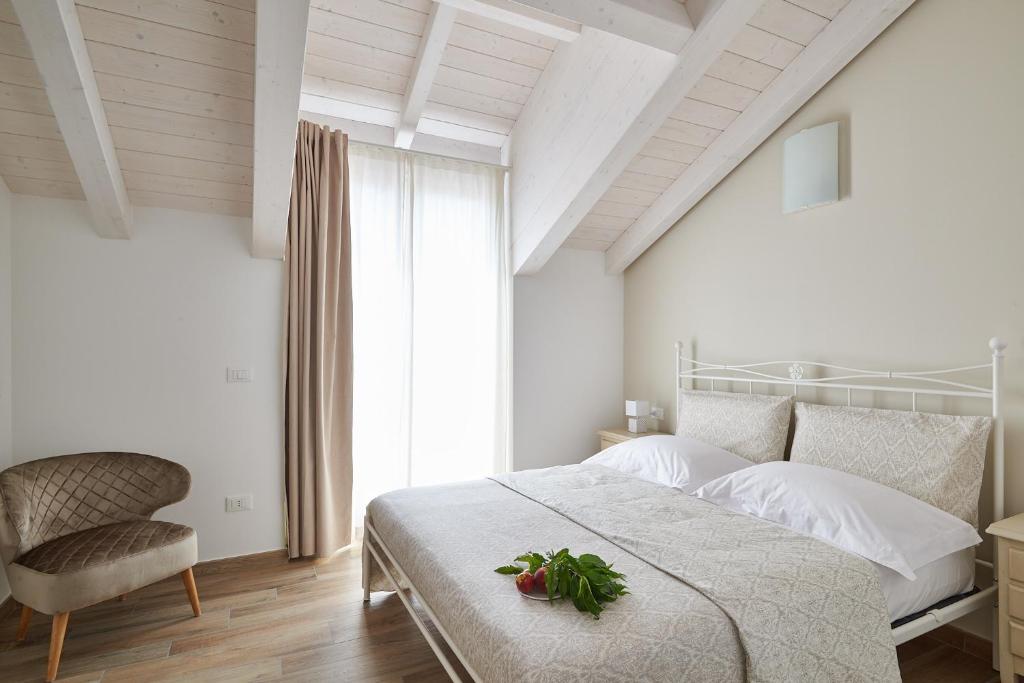 Postel nebo postele na pokoji v ubytování Agriturismo Casastella