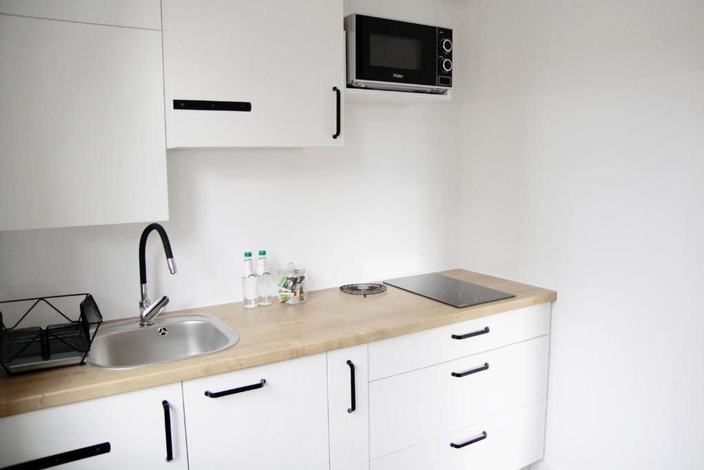 Kuchyňa alebo kuchynka v ubytovaní Apartament Flauta