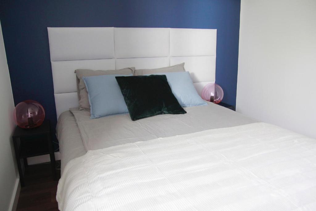 Posteľ alebo postele v izbe v ubytovaní Apartament Flauta