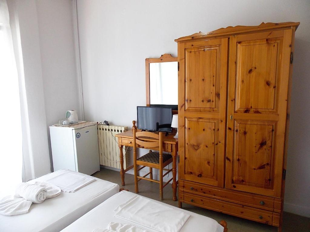 Postel nebo postele na pokoji v ubytování Hotel Sgouridis