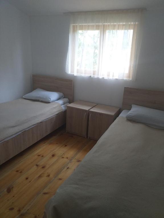 Postel nebo postele na pokoji v ubytování Guest House ALUDA